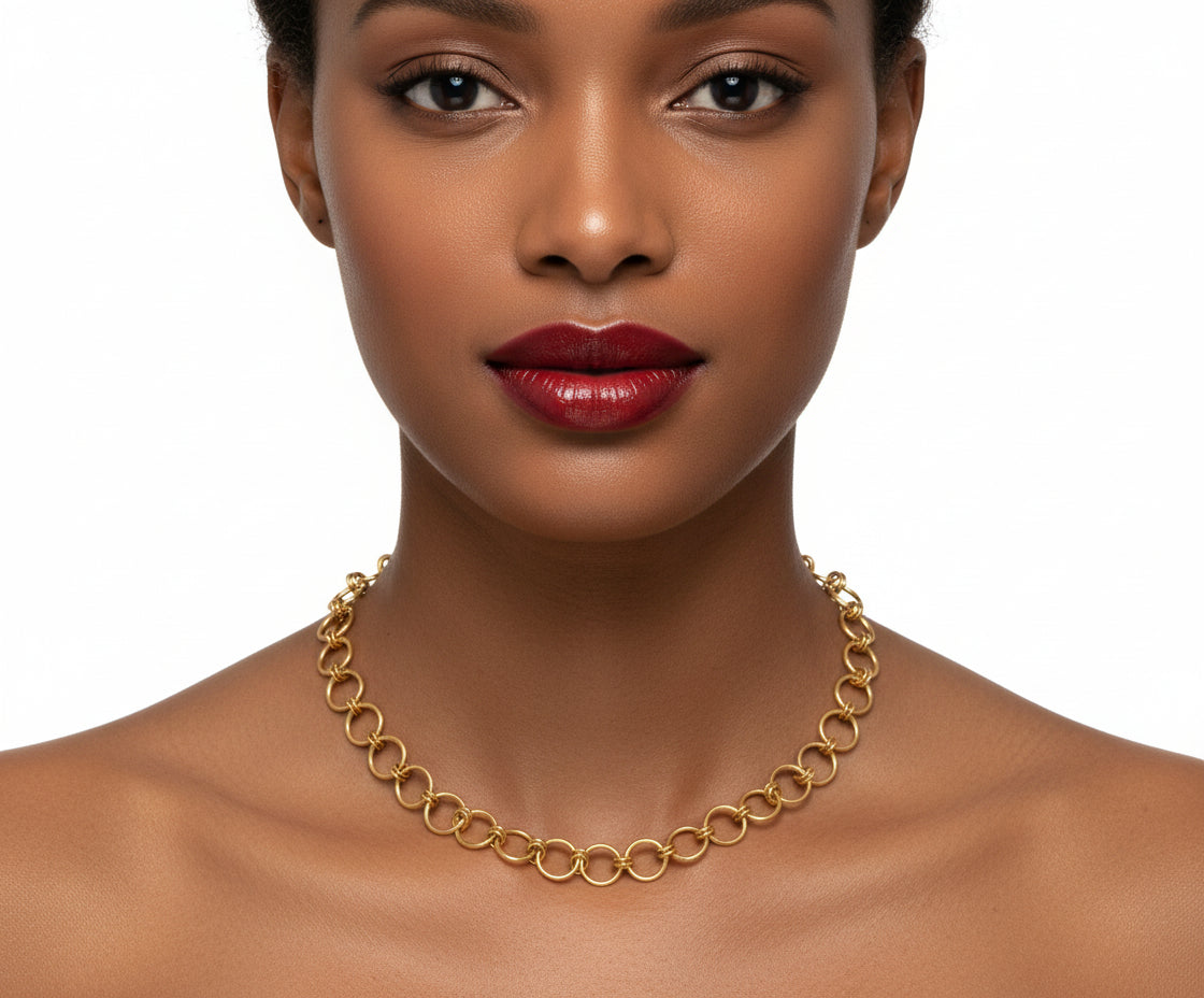 Gold chain bracelet on a white background